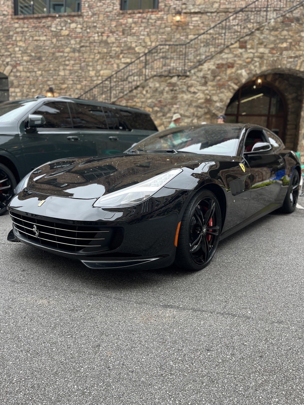 Black Ferrari with a reflective paint finish in Allen Auto Detailing’s gallery
