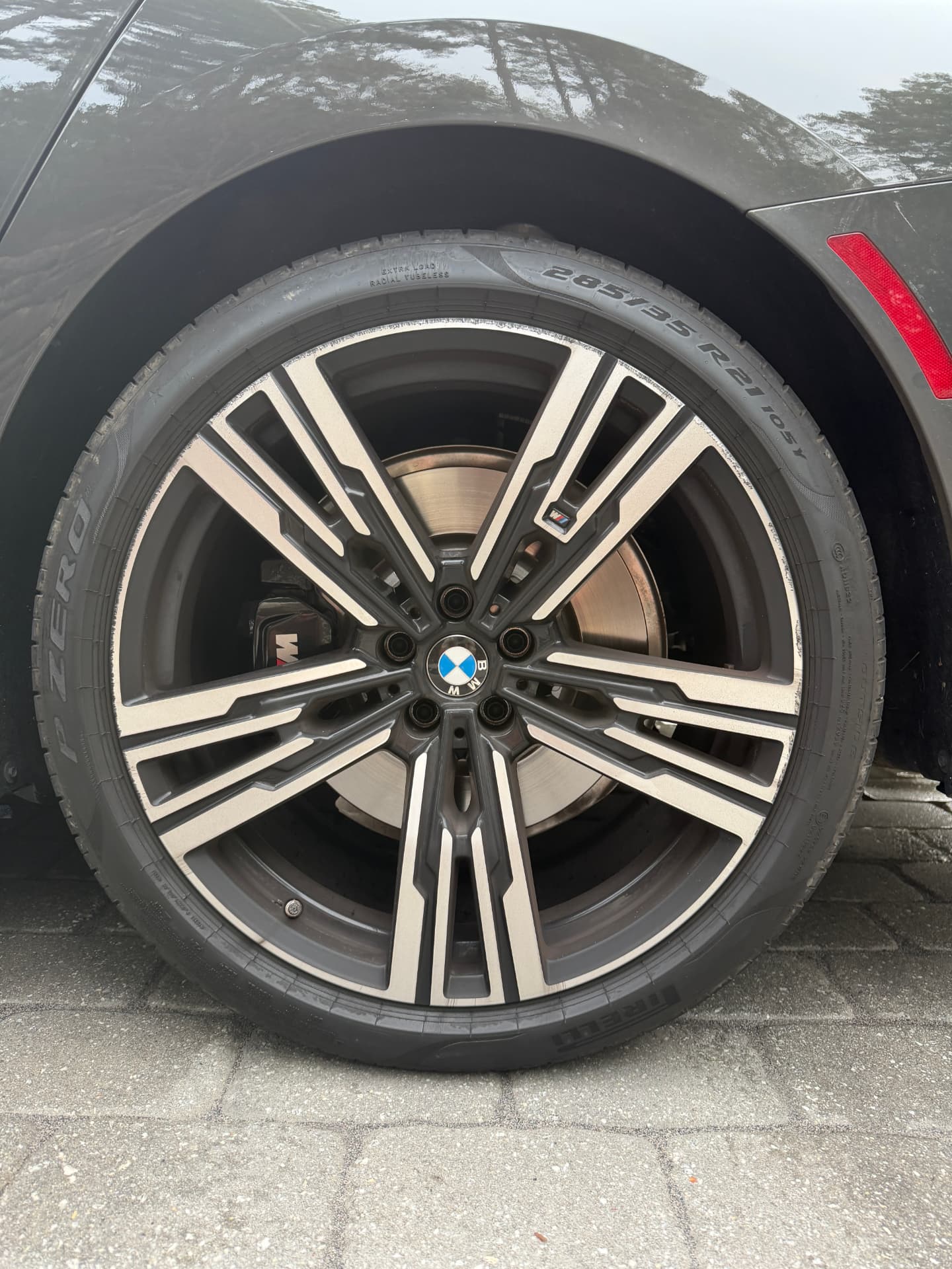 BMW wheel and tire before detailing, covered in brake dust and road grime